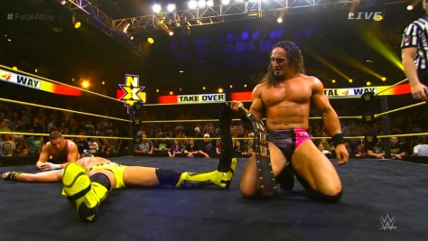 Adrian Neville holds his NXT Championship belt after pinning Tyson Kidd in a 24-minute, 5-star fatal 4-way match. Sami Zayn couldn't get back into the ring quickly enough to make the save.